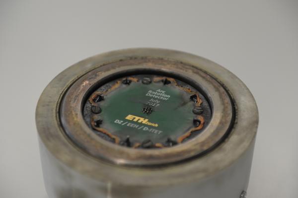 Circuit board in the mechanical fixture after the high voltage experiment. The circuit board is burnt due to the high temperatures.