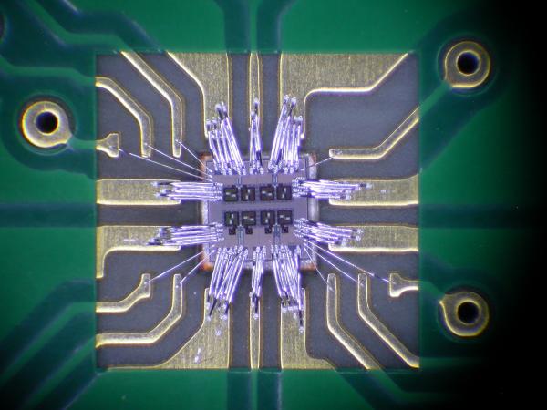 Close view from the top of the Rhino chip inside a board cavity and wire-bonded
